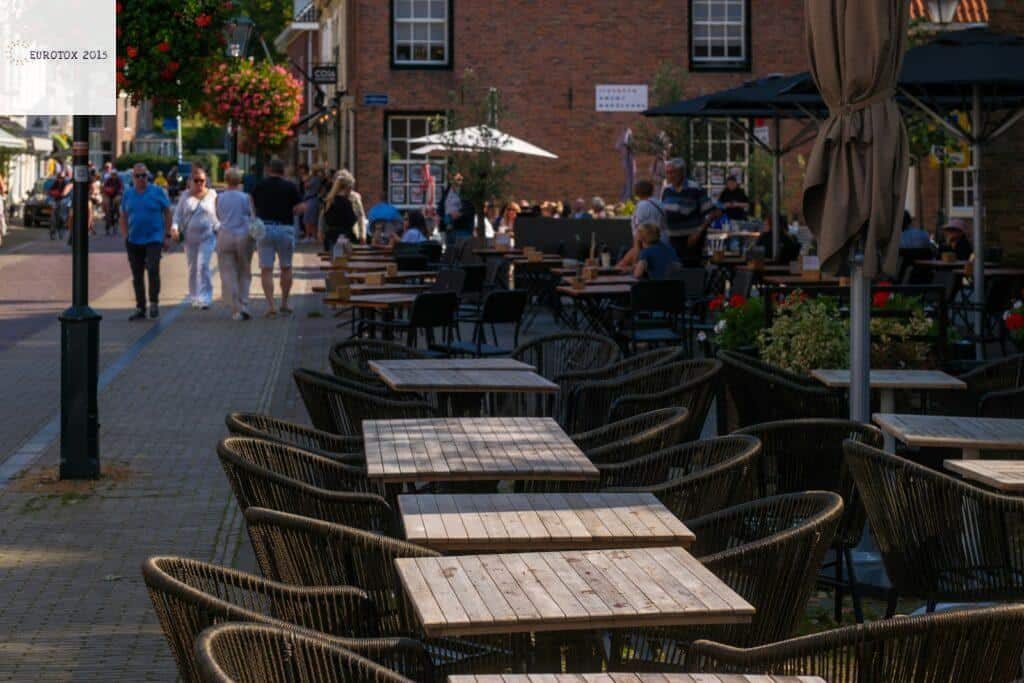 A row of tables sitting on the side of a street