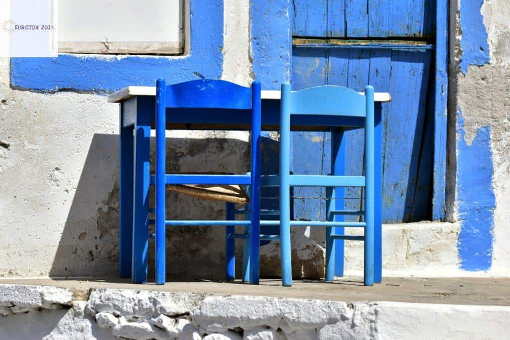 a couple of blue chairs sitting next to each other